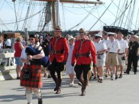 Piper, voluntary RCMP escort, crew on Market Wharf