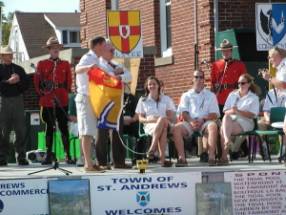 First Mate accepting NB flag from Hon. Mr. Huntjens