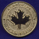 The maple leaf side of the Donor medal
